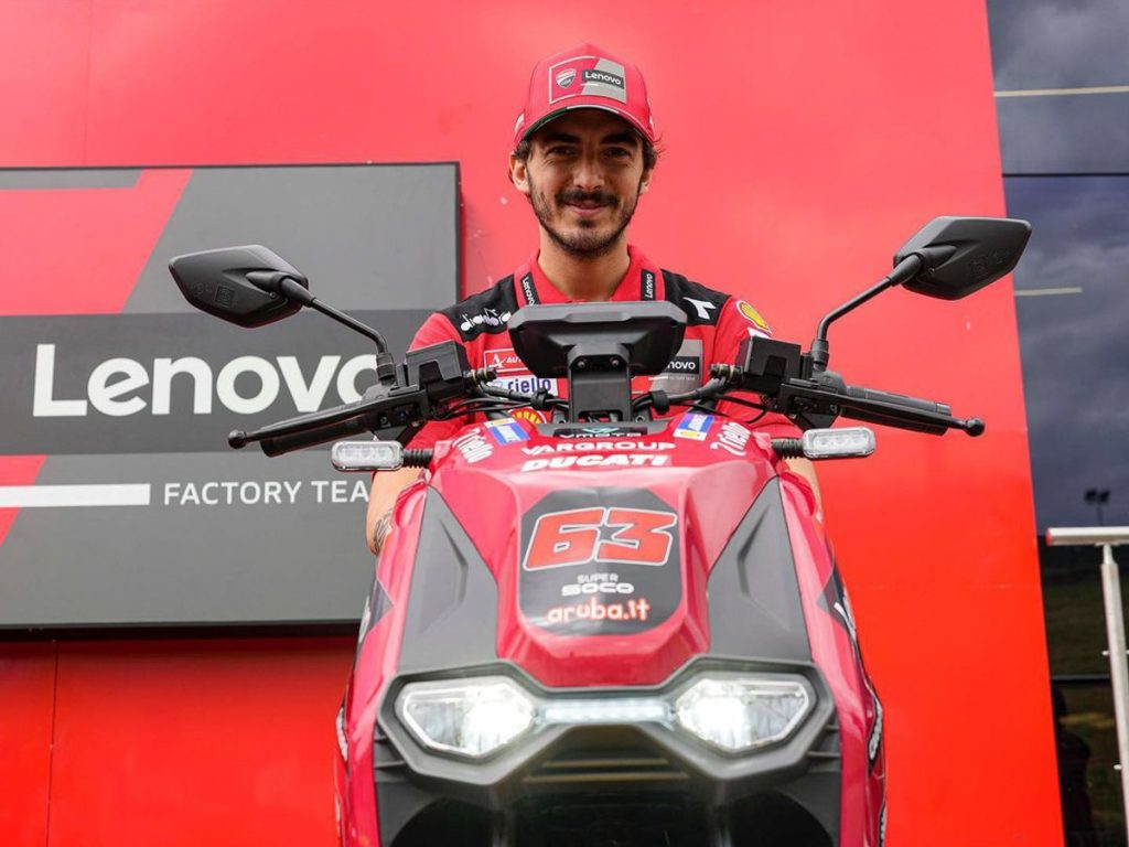 Pecco Bagnaia on the VMotoSoco CPx electric scooter of the Ducati Lenovo MotoGP team
