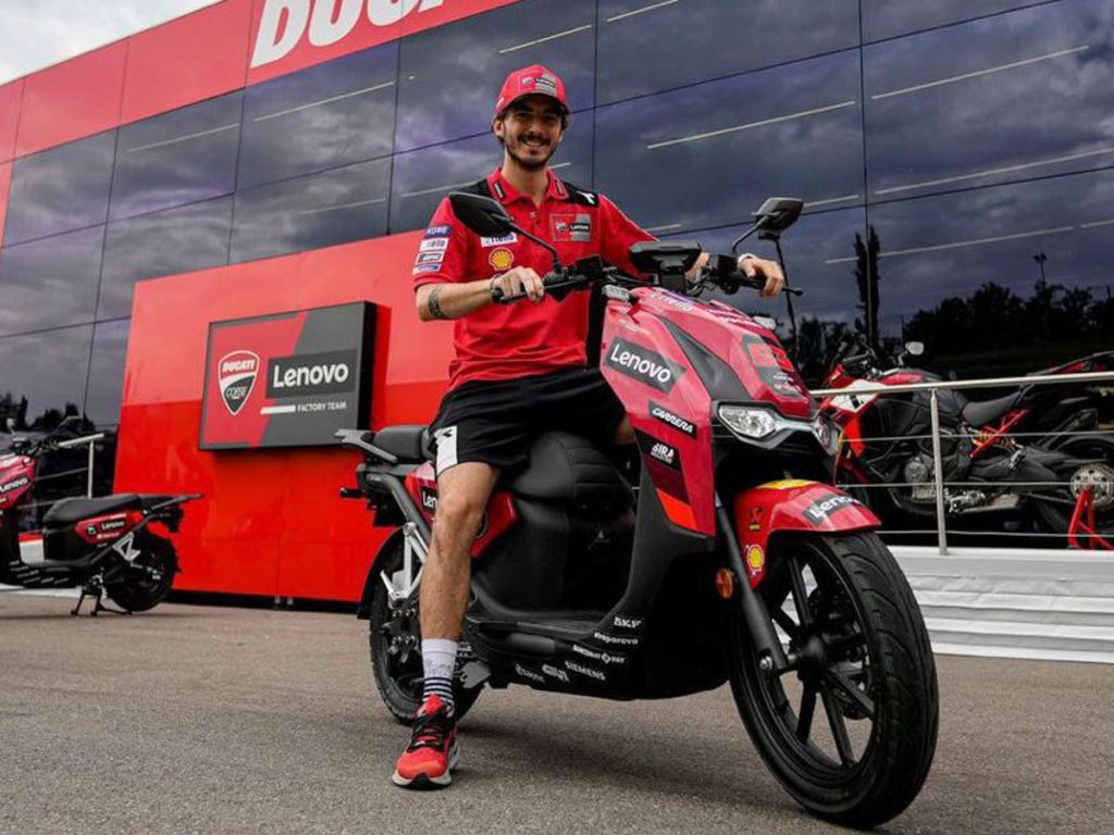 Pecco Bagnaia and the VMotoSoco CPx electric scooter of the Ducati Lenovo MotoGP team