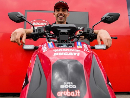 Michele Pirro on the VMotoSoco CPx electric scooter of the Ducati Lenovo MotoGP team